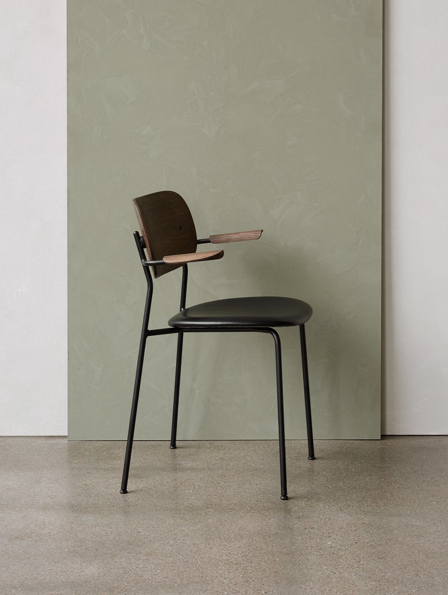 Co Dining Chair Upholstered by Menu - With Armrest / Black Powder Coated Steel / Dark Oak / Dakar Black Leather