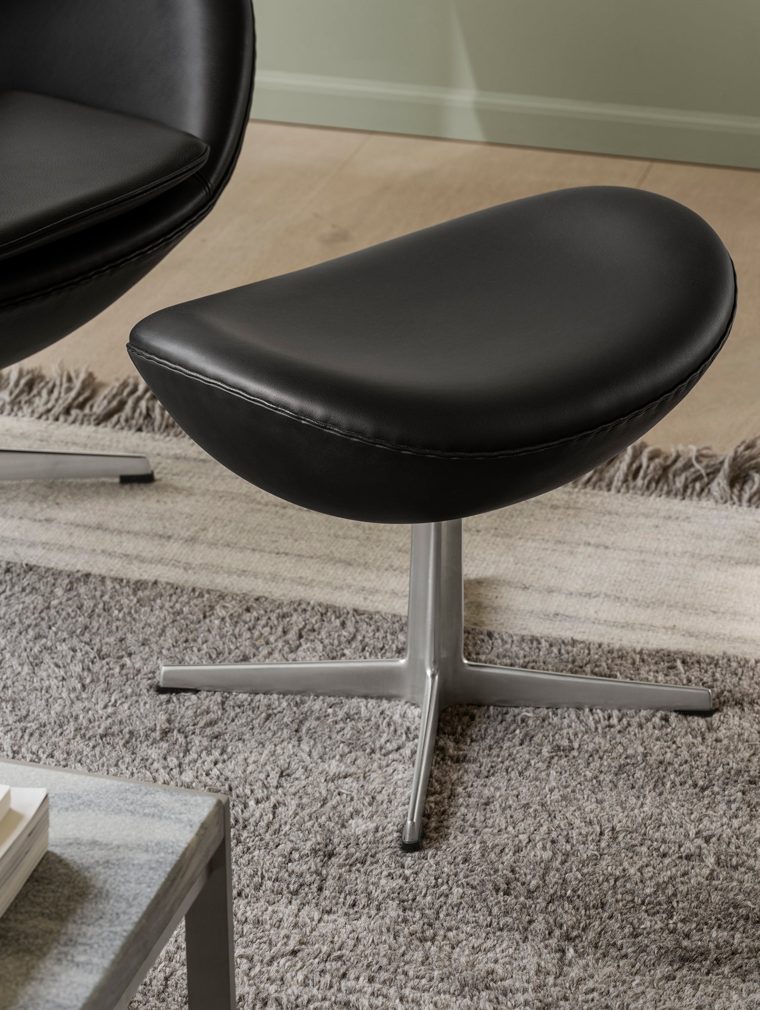 Egg Footstool by Fritz Hansen - Black Grace Leather