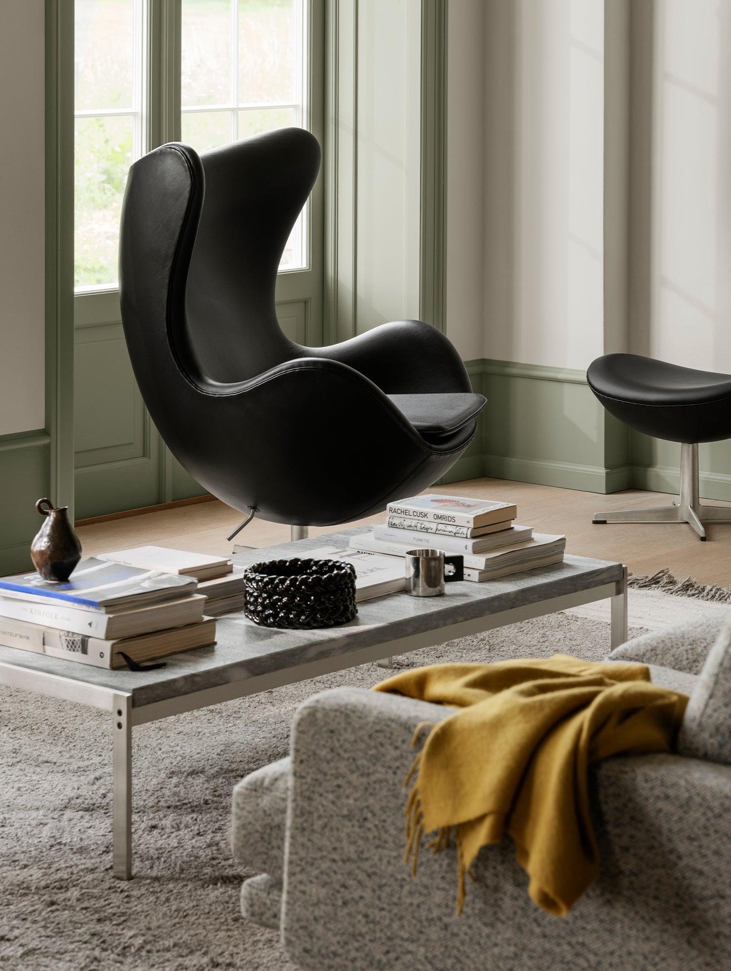 Egg Footstool by Fritz Hansen - Black Grace Leather