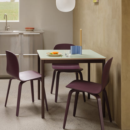Base Table by Muuto - 70x70 / Light Green Laminate / Plywood Top with Brown Red Legs