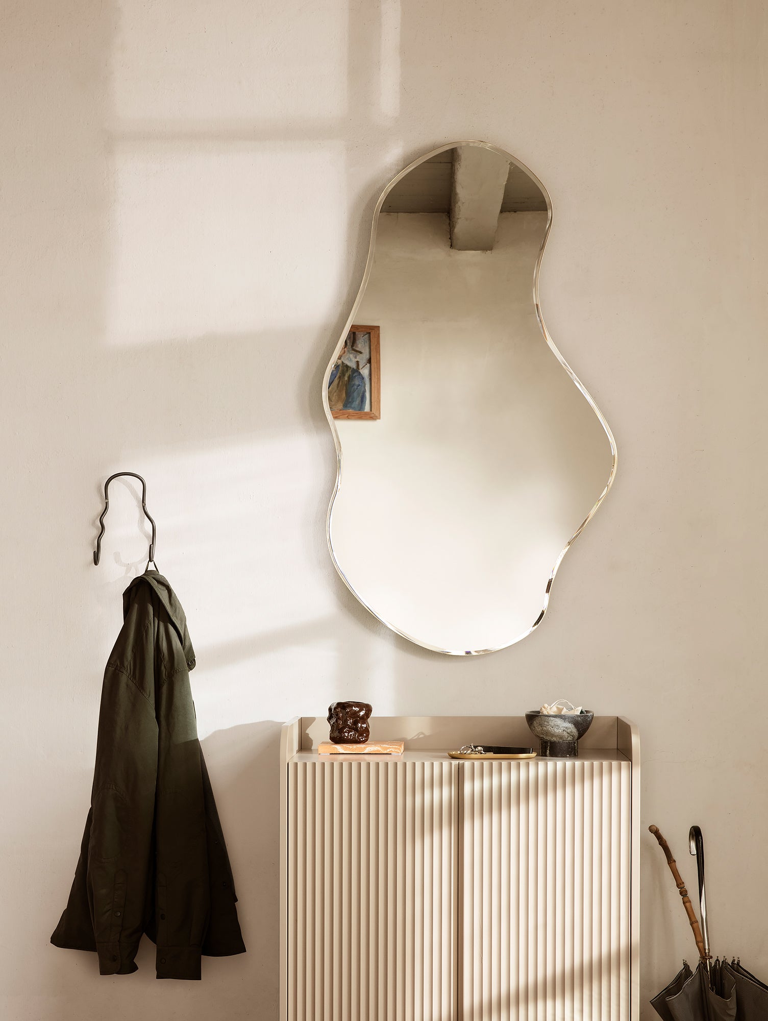 Pond Mirror by Ferm Living, Large - in a hallway setting