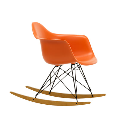 Eames RAR Plastic Armchair in Rusty Orange with Basic Dark Base and Golden Maple Rockers by Vitra